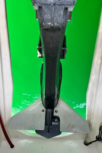 Hiolani II Yacht Photos Pics 1988 CSK Polycon boat anchor against vibrant green water background.