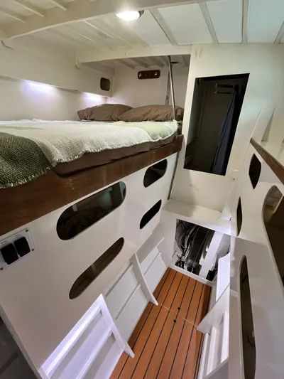 Hiolani II Yacht Photos Pics 1988 CSK Polycon interior with bunk beds and wooden flooring.
