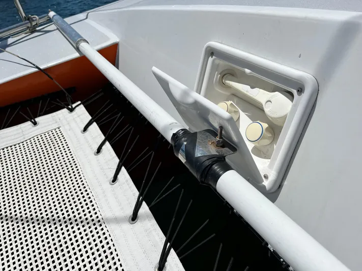 Hiolani II Yacht Photos Pics 1988 CSK Polycon boat deck with open hatch and netting.