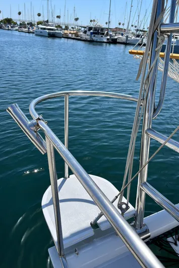 Hiolani II Yacht Photos Pics Stainless steel boat railing on a 1988 CSK Polycon, docked in a marina.