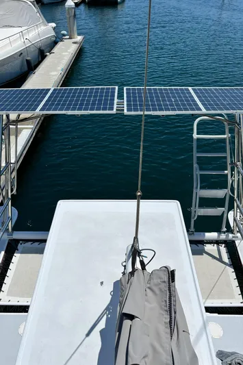 Hiolani II Yacht Photos Pics 1988 CSK Polycon boat with solar panels docked at marina.