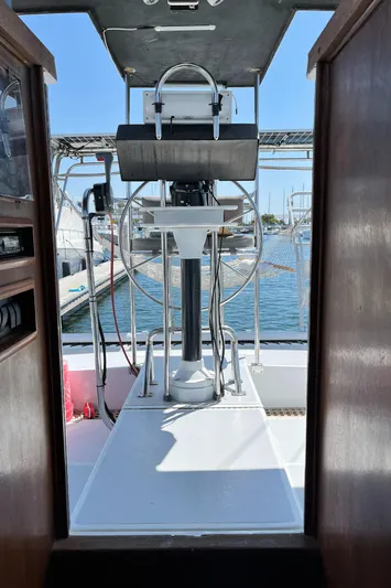 Hiolani II Yacht Photos Pics 1988 CSK Polycon boat helm with steering wheel, docked at marina.