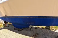Custom TRIMARAN PULSAR 33 (2002) hull, blue and white, on dry dock.