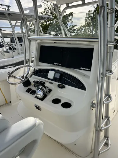 Crank It Up Yacht Photos Pics Helm of a 2006 Boston Whaler 320 Outrage with Raymarine equipment.