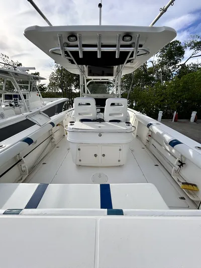 Crank It Up Yacht Photos Pics Boston Whaler 320 Outrage 2006, spacious deck, white interior.