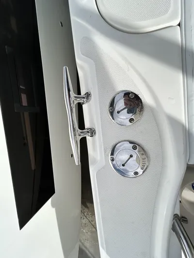 Crank It Up Yacht Photos Pics Boston Whaler 320 Outrage 2006, boat cleats and waste inlet.