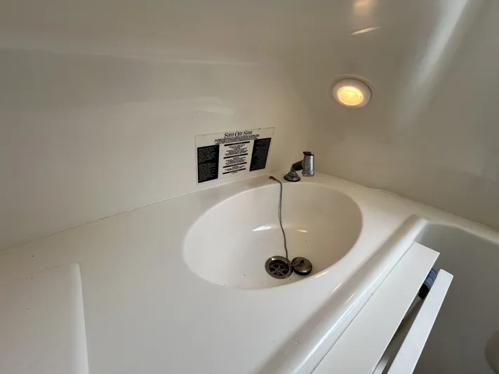 Crank It Up Yacht Photos Pics Interior of 2006 Boston Whaler 320 Outrage with sink.