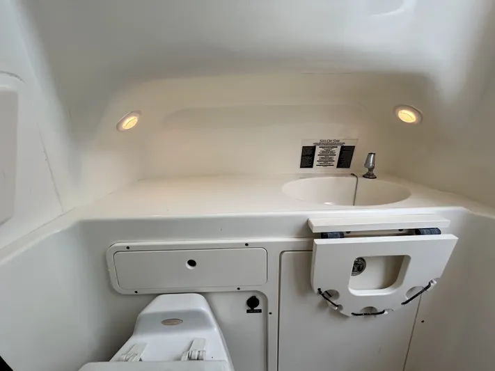 Crank It Up Yacht Photos Pics Interior of 2006 Boston Whaler 320 Outrage with sink.
