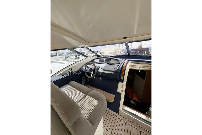  Yacht Photos Pics Interior of 2005 Cantieri di Sarnico 50 yacht, featuring helm and seating area.