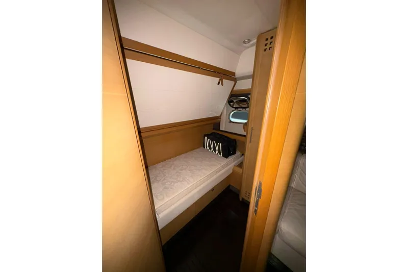  Yacht Photos Pics Compact cabin interior of 2005 Cantieri di Sarnico 50 yacht with wooden finishes.