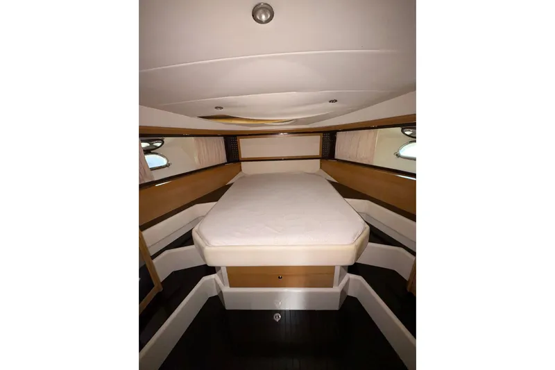  Yacht Photos Pics Luxurious 2005 Cantieri di Sarnico 50 yacht cabin interior with elegant bedding.