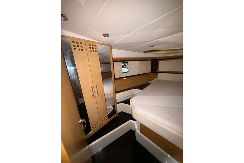  Yacht Photos Pics Luxurious 2005 Cantieri di Sarnico 50 yacht cabin with modern wood finishes.