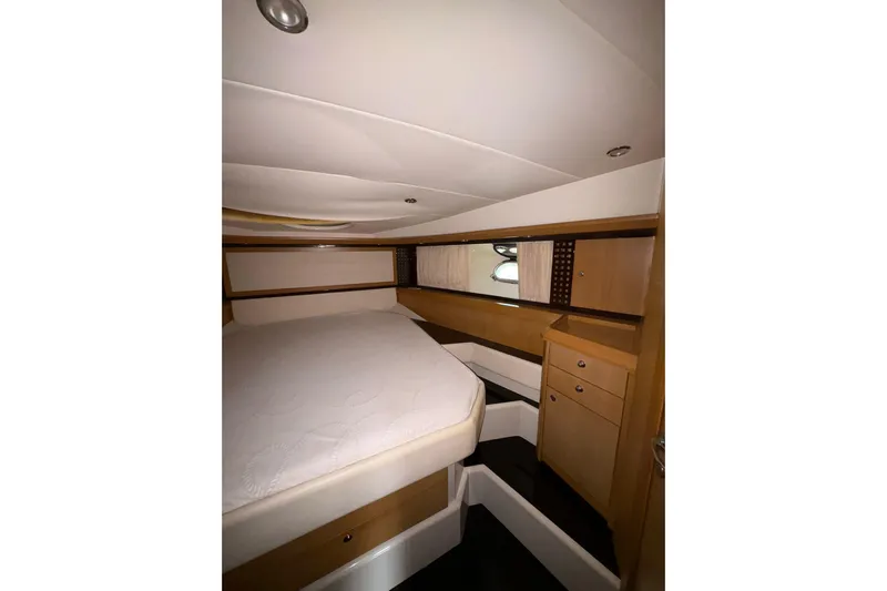 Yacht Photos Pics Luxurious cabin interior of 2005 Cantieri di Sarnico 50 yacht, featuring elegant wood finishes.