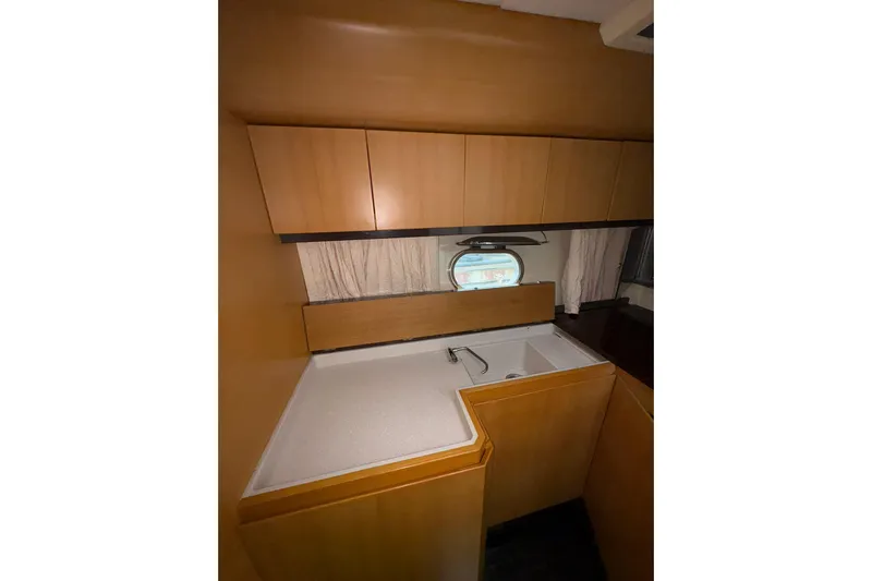  Yacht Photos Pics Interior of 2005 Cantieri di Sarnico 50 yacht, featuring a compact kitchen area.
