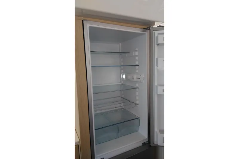 Double Kiss Yacht Photos Pics Empty Bali 4.1 refrigerator, 2018 model, with open door and glass shelves.