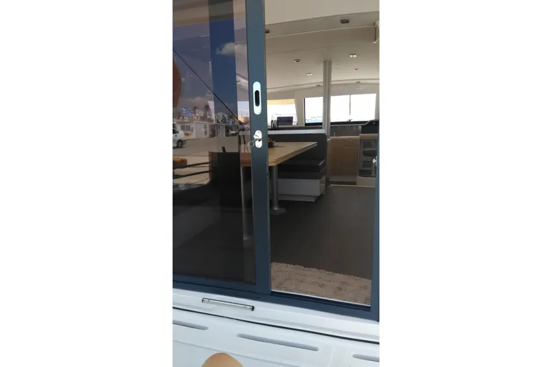 Double Kiss Yacht Photos Pics Interior view of 2018 Bali 4.1 catamaran through sliding glass door.