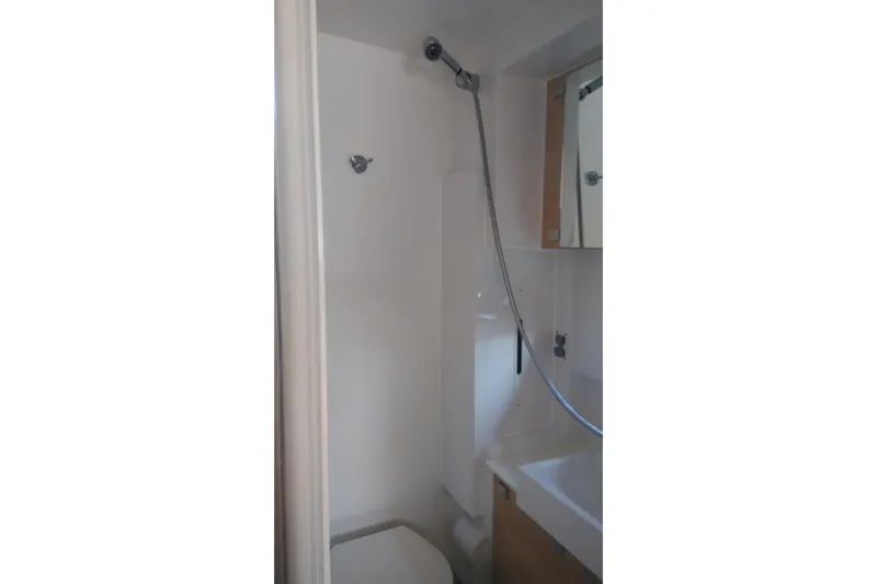 Double Kiss Yacht Photos Pics Compact bathroom in 2018 Bali 4.1 model with shower and sink.