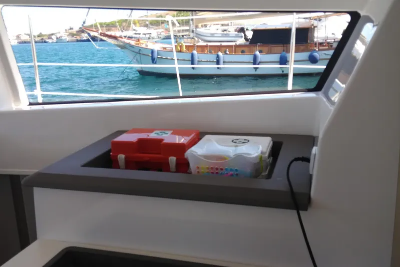 Double Kiss Yacht Photos Pics Interior of 2018 Bali 4.1 yacht with first aid kit and sea view.