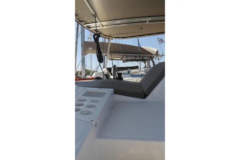 Double Kiss Yacht Photos Pics Bali 4.1 catamaran deck view, 2018 model, featuring seating and cup holders.