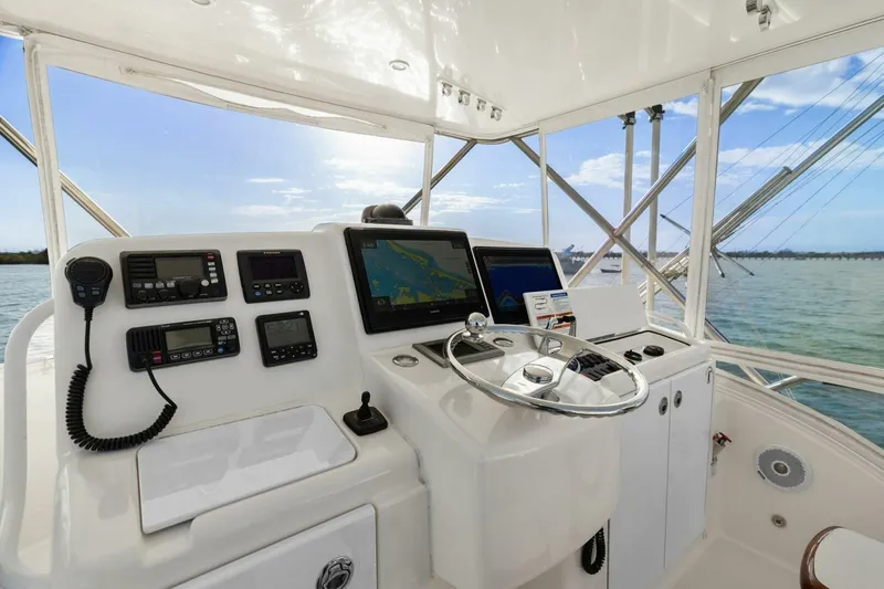 Salty Dach Yacht Photos Pics 2013 Tiara Yachts 3900 Convertible helm with navigation equipment and ocean view.