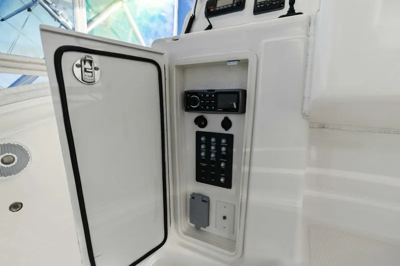 Salty Dach Yacht Photos Pics Control panel inside Tiara Yachts 3900 Convertible, 2013 model, featuring audio and switch controls.
