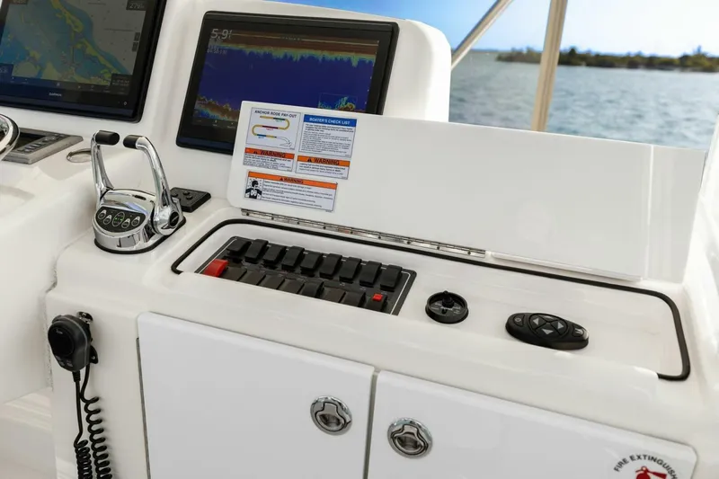 Salty Dach Yacht Photos Pics Control panel of 2013 Tiara Yachts 3900 Convertible with navigation screens and throttle.