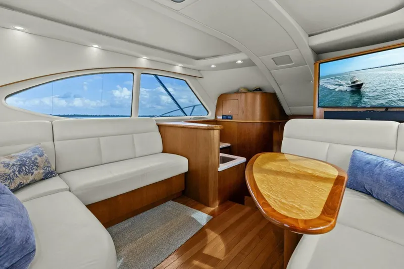 Salty Dach Yacht Photos Pics Luxurious interior of 2013 Tiara Yachts 3900 Convertible with elegant seating and ocean view.