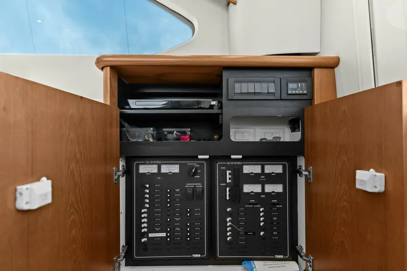 Salty Dach Yacht Photos Pics Electrical panel inside 2013 Tiara Yachts 3900 Convertible, showcasing AC and DC systems.