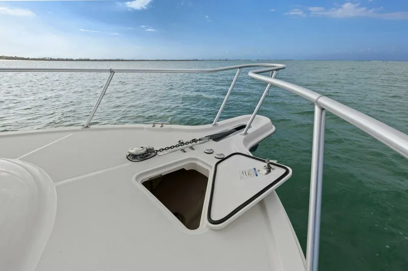 Salty Dach Yacht Photos Pics Bow view of 2013 Tiara Yachts 3900 Convertible on calm waters.