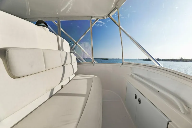 Salty Dach Yacht Photos Pics 2013 Tiara Yachts 3900 Convertible interior with ocean view, featuring white seating.
