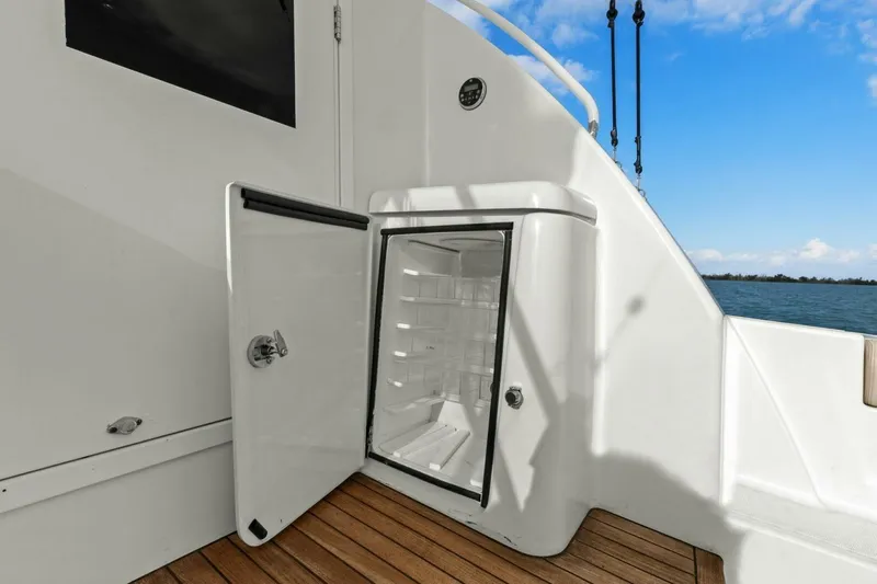 Salty Dach Yacht Photos Pics Open fridge on 2013 Tiara Yachts 3900 Convertible, wooden deck, ocean view.