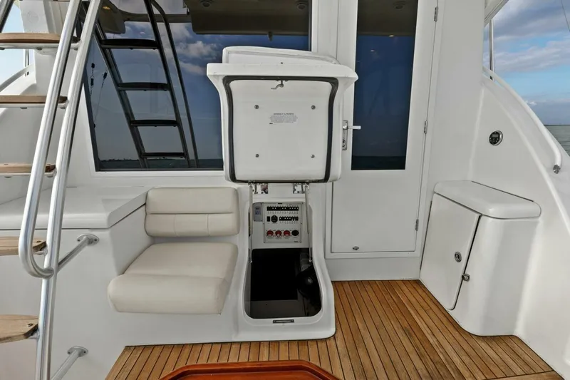 Salty Dach Yacht Photos Pics 2013 Tiara Yachts 3900 Convertible interior with seating and control panel.