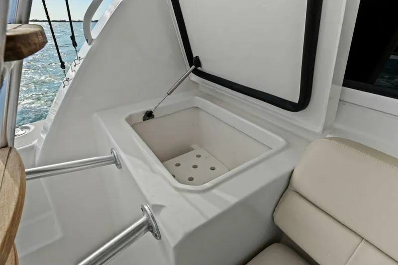 Salty Dach Yacht Photos Pics 2013 Tiara Yachts 3900 Convertible interior with storage compartment and seating.