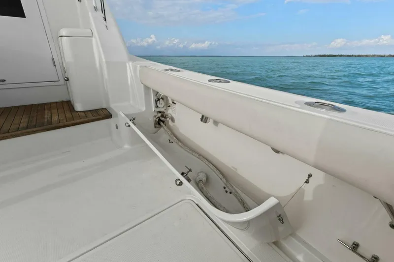 Salty Dach Yacht Photos Pics 2013 Tiara Yachts 3900 Convertible deck with ocean view, featuring clean white surfaces.
