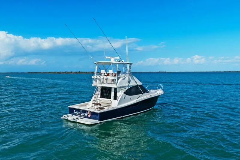 Salty Dach Yacht Photos Pics 2013 Tiara Yachts 3900 Convertible on open water under clear blue sky.