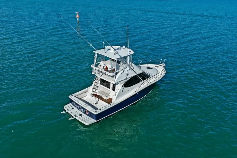 Salty Dach Yacht Photos Pics 2013 Tiara Yachts 3900 Convertible cruising on open blue waters.