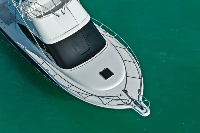 Salty Dach Yacht Photos Pics Aerial view of 2013 Tiara Yachts 3900 Convertible on turquoise water.