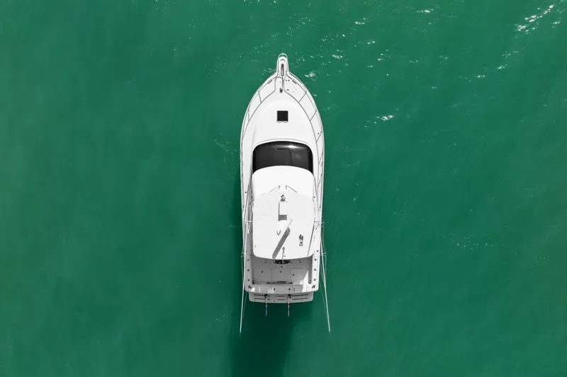 Salty Dach Yacht Photos Pics Overhead view of 2013 Tiara Yachts 3900 Convertible on turquoise water.