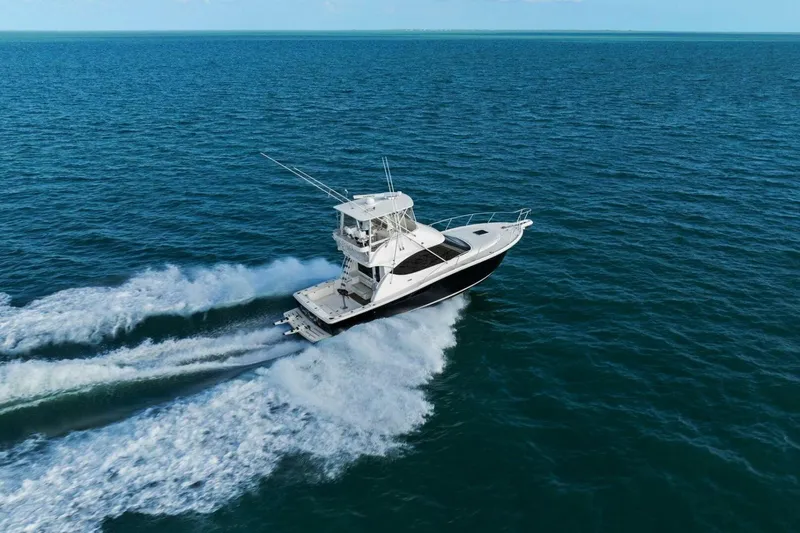 Salty Dach Yacht Photos Pics 2013 Tiara Yachts 3900 Convertible cruising on open ocean waters.