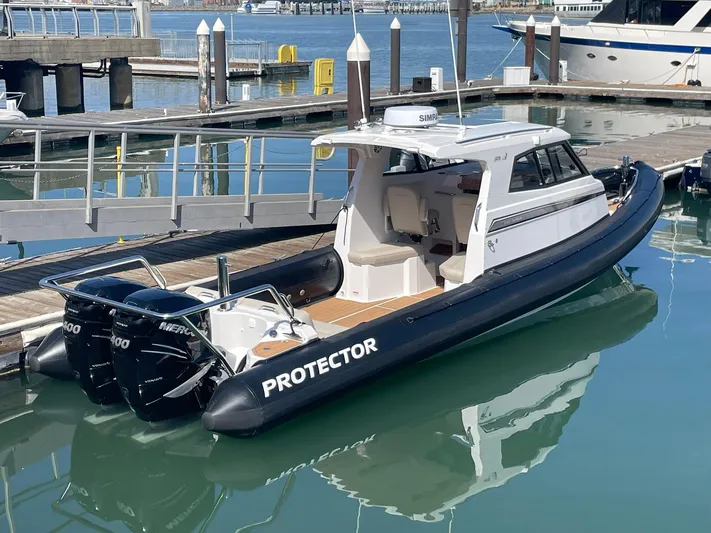 Maneki Neko Yacht Photos Pics 2021 Protector 330 Targa boat with twin Mercury 350 HP engines docked in marina.