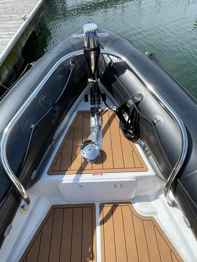 Maneki Neko Yacht Photos Pics 2021 Protector 330 Targa boat bow with teak flooring and anchor system.