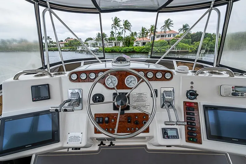 Faintasea Yacht Photos Pics Cockpit view of 2000 Silverton 442 Cockpit Motor Yacht with navigation instruments.