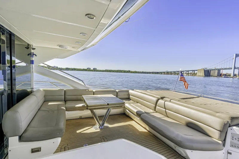  Yacht Photos Pics Luxurious 2014 Sunseeker 68 Sport Yacht deck with seating, table, and scenic water view.