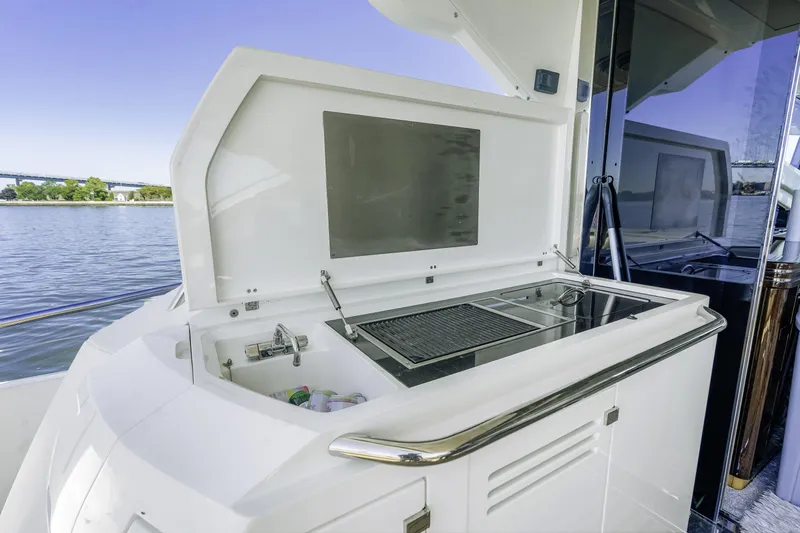  Yacht Photos Pics Outdoor kitchen on 2014 Sunseeker 68 Sport Yacht with grill and sink by the water.