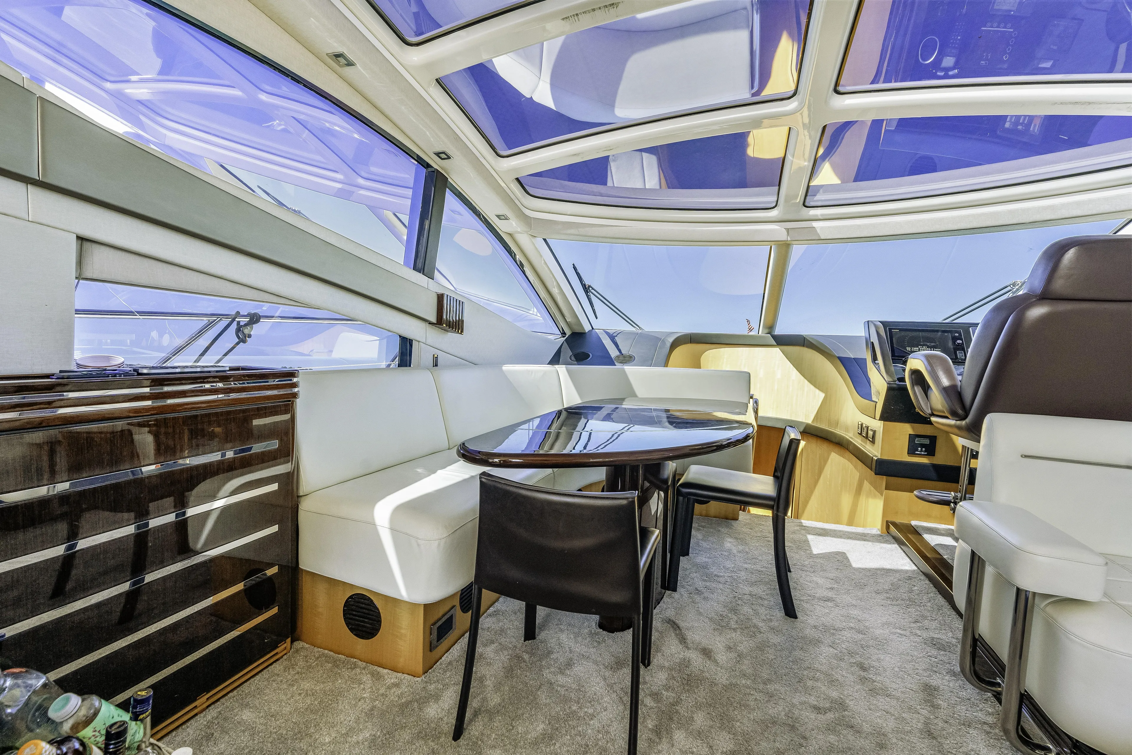  Yacht Photos Pics Luxurious interior of 2014 Sunseeker 68 Sport Yacht with panoramic windows and elegant seating.
