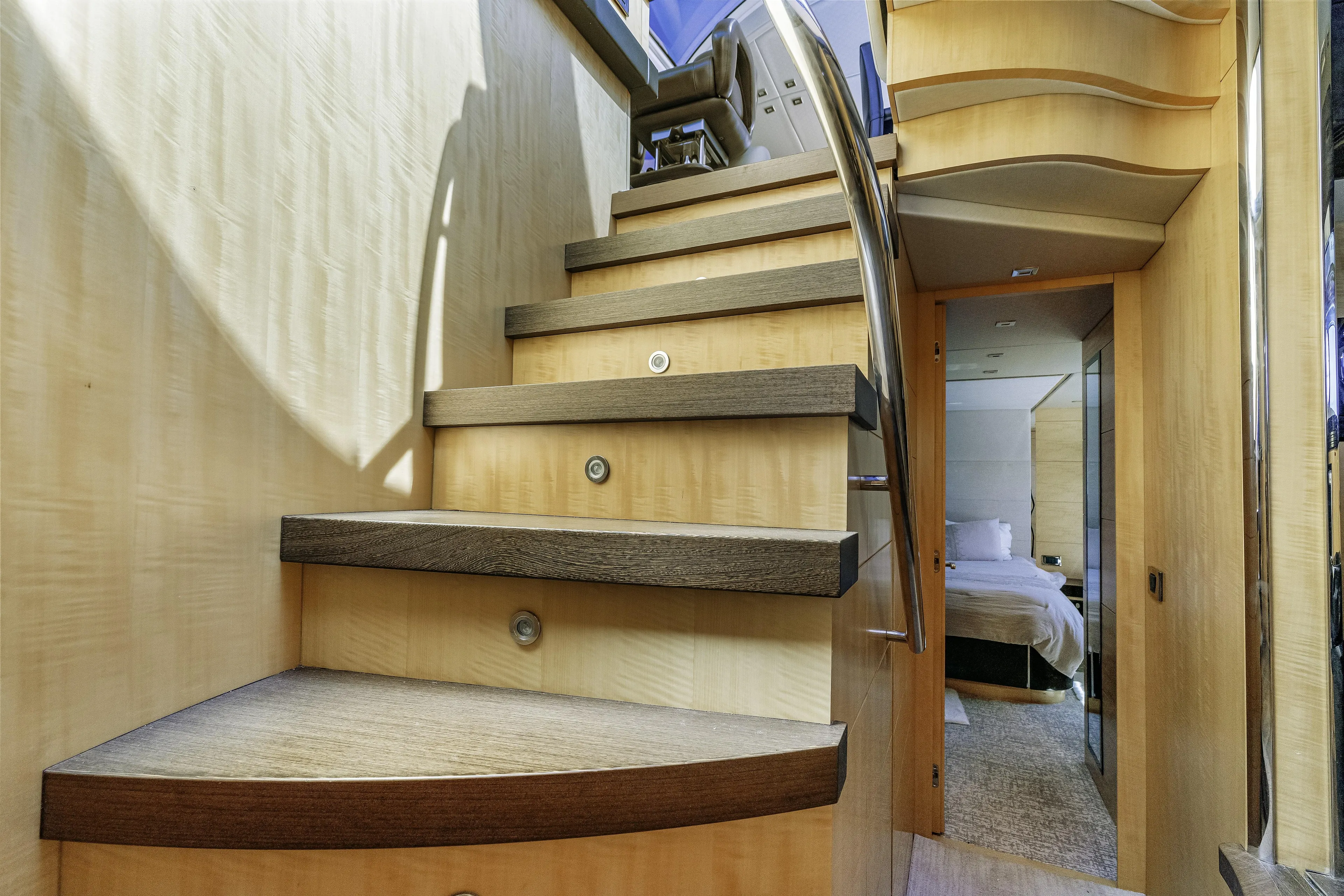  Yacht Photos Pics Interior staircase of 2014 Sunseeker 68 Sport Yacht, leading to a luxurious bedroom.