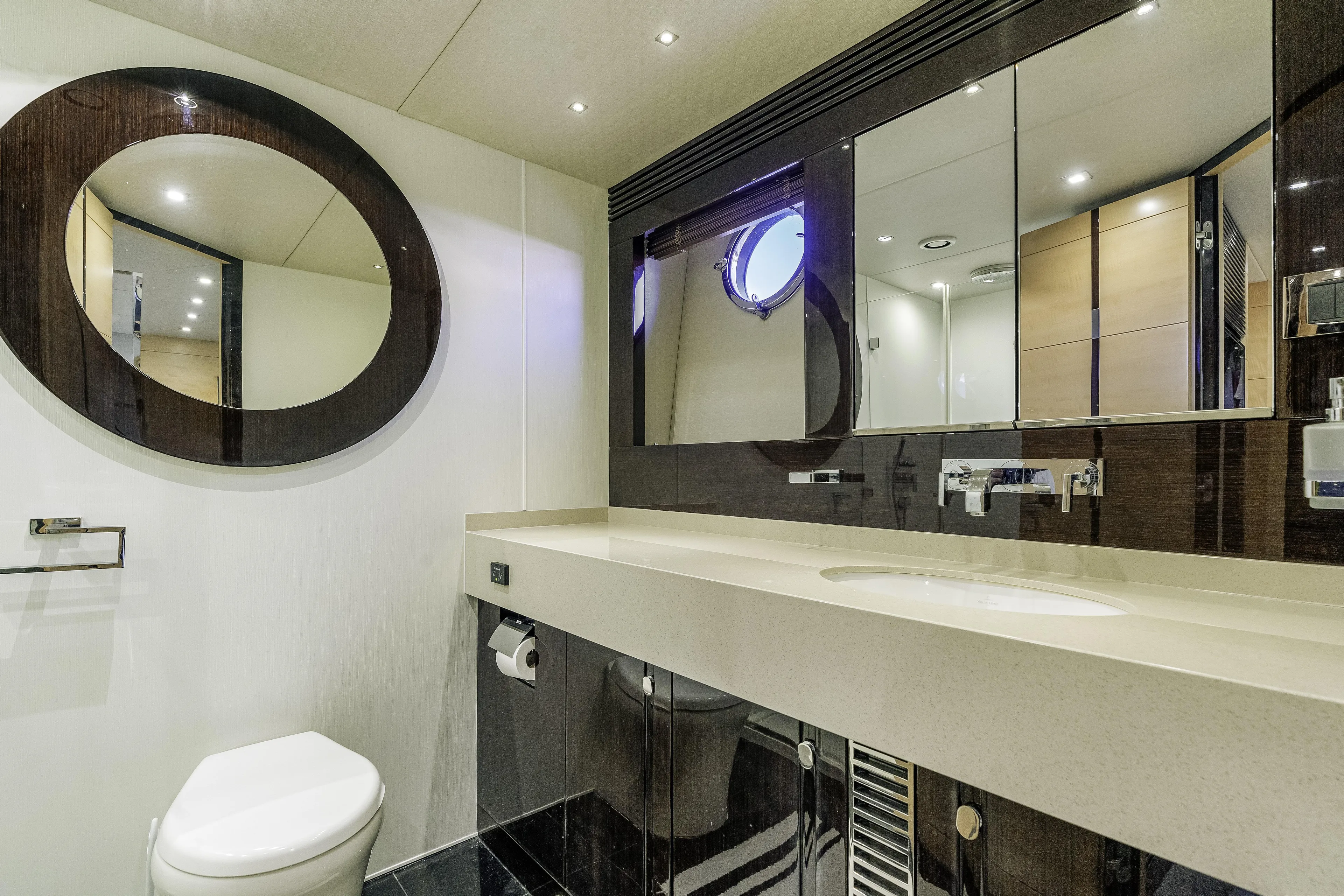  Yacht Photos Pics Luxurious bathroom in 2014 Sunseeker 68 Sport Yacht with modern fixtures and elegant design.