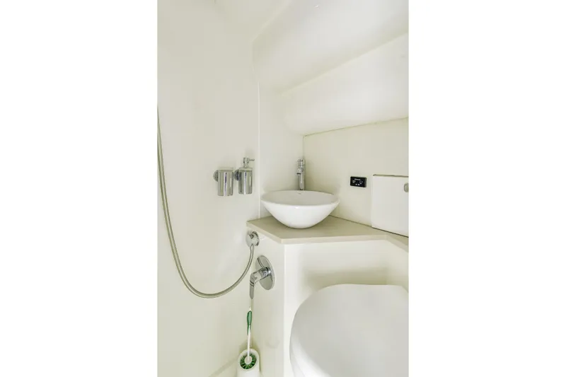  Yacht Photos Pics Bathroom interior of 2014 Sunseeker 68 Sport Yacht with modern fixtures.