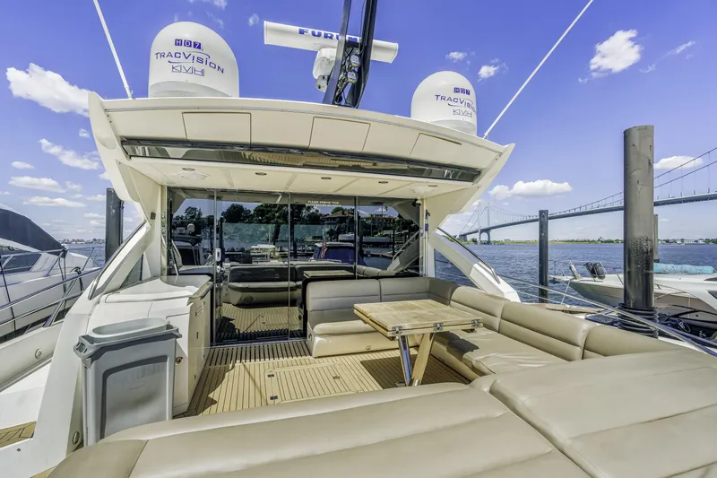  Yacht Photos Pics Luxurious 2014 Sunseeker 68 Sport Yacht with spacious deck and seating area.