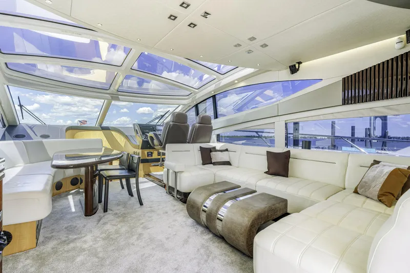  Yacht Photos Pics Luxurious interior of 2014 Sunseeker 68 Sport Yacht with panoramic windows and elegant seating.